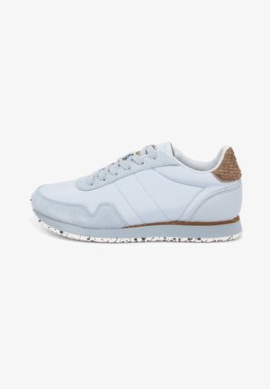 Light blue athletic shoe featuring a smooth leather and suede upper, textured brown accent at the heel, and a speckled white rubber sole.