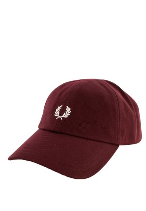 Cappellino da baseball color marrone scuro con visiera curva e logo ricamato a corona di alloro bianca centrato sul pannello frontale.