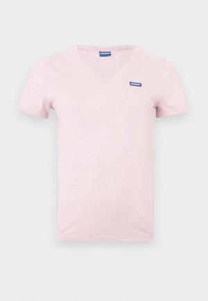 Pink cotton t-shirt with a v-neck and short sleeves, featuring a blue "HUGO" logo on the left chest. Smooth texture and simple design.
