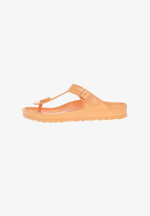 Orangene Gummisandale mit Schnallenriemen, strukturiertem Fußbett und konturiertem Fußbett. Leichtes Design, geeignet für den Freizeitgebrauch.