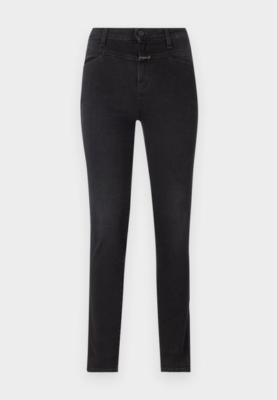Melnas denim skinny džinsas ar šaura piegriezuma, piecu kabatu dizainu, pogas un rāvējslēdzēja aizdari, kā arī smalkām šuvju detaļām gar šuvēm.