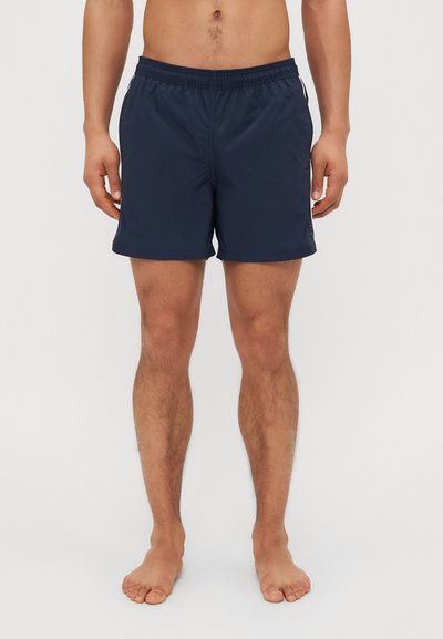 Marineblaue Badeshorts mit einem elastischen Taillenbund. Hergestellt aus leichtem Material, mit einem schlichten, glatten Design ohne Muster oder Akzente.