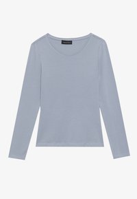 Light blue long-sleeve top with a rounded neckline, crafted from soft fabric. Features clean seams and a straight hem. Brand label visible.