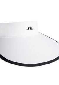 Vit visirkeps med svart kant. Har en slät yta och en minimalistisk logotyp på framsidan. Utformad för solskydd under utomhusaktiviteter.