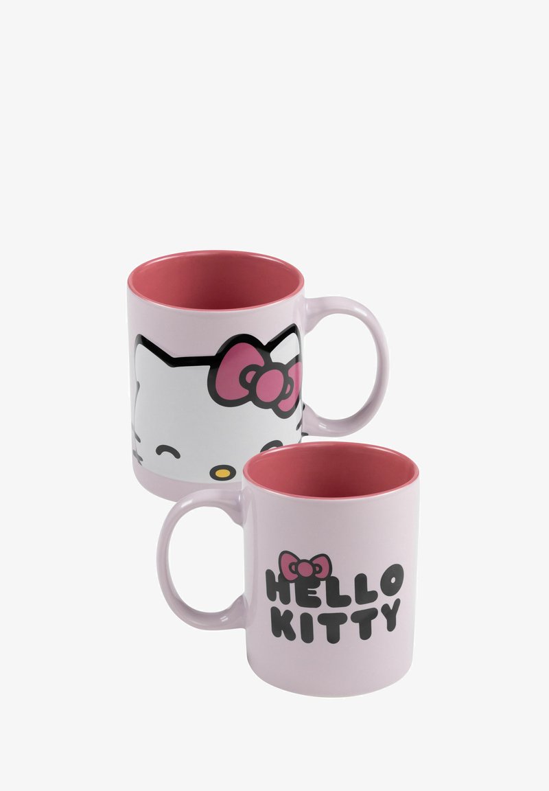 Tazza in ceramica rosa con il volto bianco di Hello Kitty da un lato e il testo "HELLO KITTY" dall'altro, con un interno e un manico rosa.