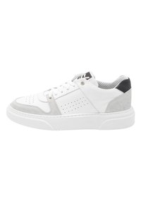White leather sneakers with gray suede accents, perforated detailing, and a thick white sole; black heel tab and mesh inner lining.
