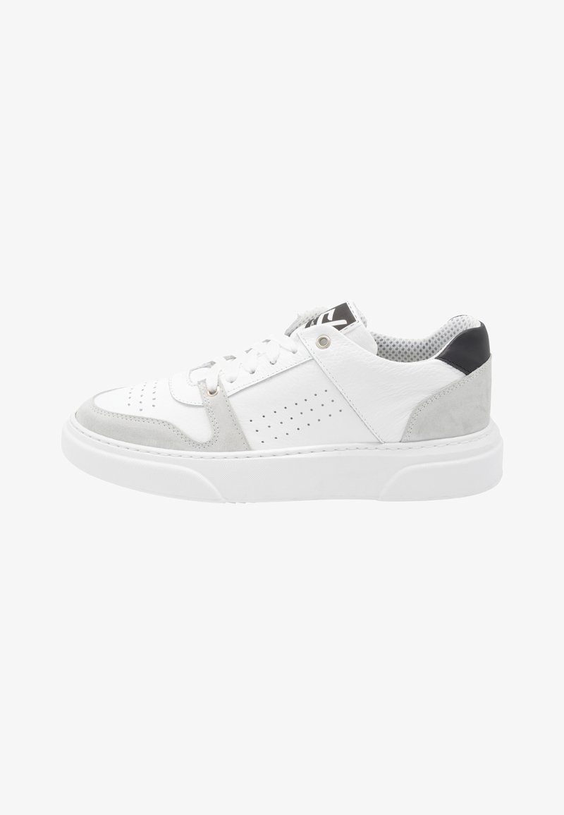 White leather sneakers with gray suede accents, perforated detailing, and a thick white sole; black heel tab and mesh inner lining.