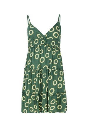 Grøn spaghetti strop kjole med et tieret design, der har et cirkulært mønster i gult. Letvægtsstof med en afslappet pasform.