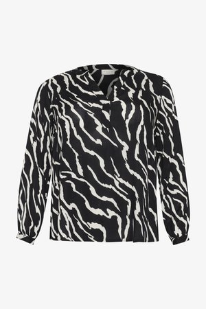 Blusa a maniche lunghe in bianco e nero con motivo a strisce zebra, caratterizzata da una scollatura a V e polsini arricciati. Realizzata in tessuto leggero.