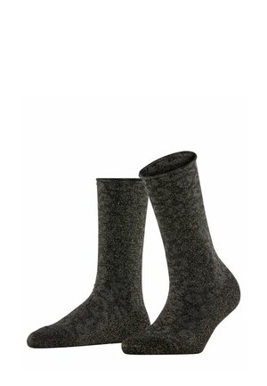 Schwarze Socken mit einem strukturierten Design, verziert mit metallischen goldenen Punkten. Knöchelhöhe mit glatter Oberfläche und verstärktem Zeh.