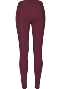 Burgundské legíny se hladkým, elastickým materiálem. Mají vysoký pás a těsný střih na nohou, bez viditelných vzorů.