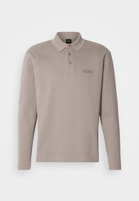 Long-sleeve beige polo shirt with three buttons and subtle BOSS logo on the left chest, displayed on a neutral background.