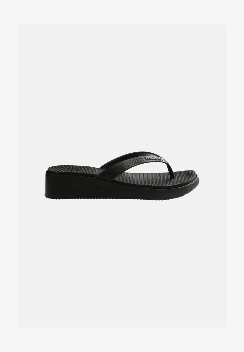 Black wedge flip-flop sandal with textured footbed and thin straps featuring subtle branding on a plain white background.