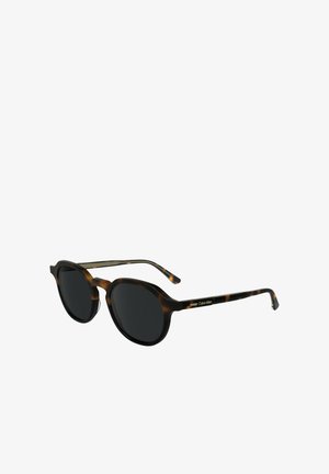 Ronde zonnebril met een schildpadbrilrand, donkere lenzen en zwarte metalen accenten. De armen zijn voorzien van een zilveren Calvin Klein-logo.