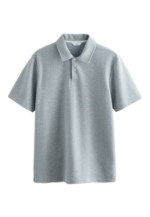 Polo a maniche corte con colletto in tessuto azzurro chiaro texture con un motivo a piccoli quadri e patta con tre bottoni.