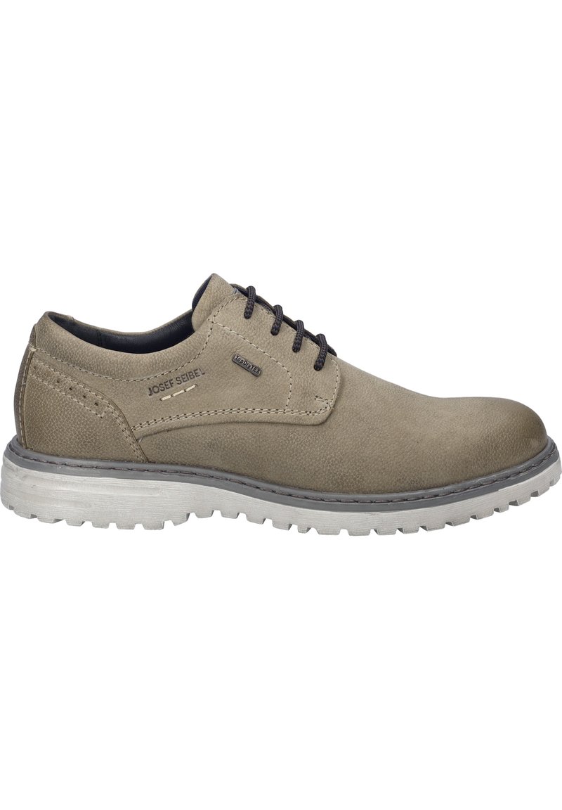 Scarpa in pelle beige con lacci grigio scuro, punta rotonda e tomaia testurizzata. Presenta una suola in gomma con un motivo di battistrada visibile e dettaglio con logo.