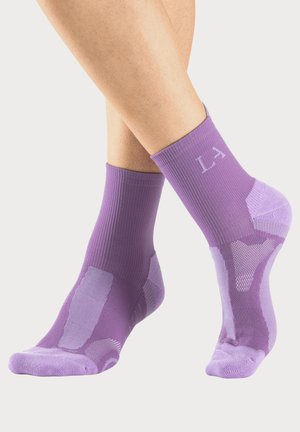 Purple ankle socks with ribbed texture, featuring mesh sections and reinforced heel. Embossed "LA" logo in light purple.