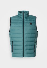 Doudoune légère teal avec un col haut, fermeture éclair sur le devant et poches latérales. Présente des accents noirs contrastants et une texture matelassée.