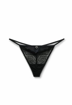 Černé krajkové tanga s květinovým vzorem, saténovým pasem a malým přívěskem ve tvaru srdce uprostřed přední části. Minimalistický design.