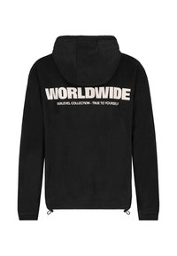 Black hooded sweatshirt featuring a soft texture, drawstring hem, and large white text on the back: “WORLDWIDE SUBLEVEL COLLECTION – TRUE TO YOURSELF.”