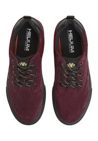 Burgundy suede sneakers with black accents, round toe, textured surface, and shoe laces featuring reflective yellow stripes.