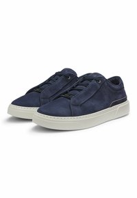 Pair of navy blue suede sneakers with white rubber soles and navy laces, viewed from front left angle on white background.