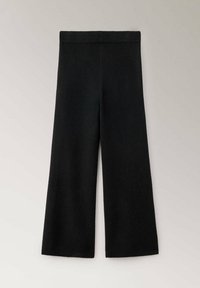 Pantalon en maille noire à jambes larges avec ceinture élastique, présenté à plat sur un fond clair.