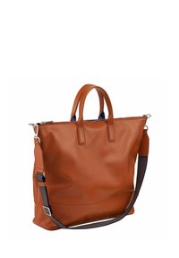 Bruine leren totebag met dubbele handvatten en een verstelbare schouderriem. Heeft een soepele textuur en subtiele stiksels.