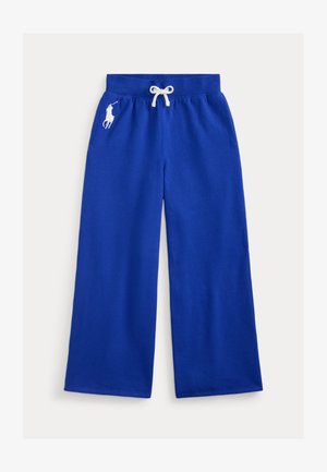 Zilas plašas svārku bikses ar aukliņu jostu, kreisajā pusē ar baltu izšūtu logotipu un priekšējām kabatām.