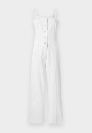 White denim jumpsuit with wide legs, square neckline, and adjustable straps. Features five buttons down the front and side pockets.