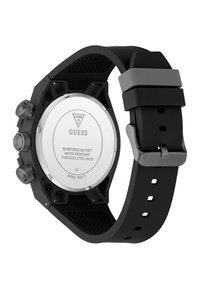 Orologio Guess nero con retro in acciaio inossidabile, tre pulsanti laterali, resistenza all'acqua fino a 50 metri e cinturino regolabile in silicone.