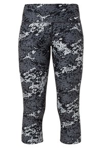 Leggings courts Nike à motif camouflage pixellisé noir et gris, taille haute avec petit logo blanc Nike sur la hanche gauche.