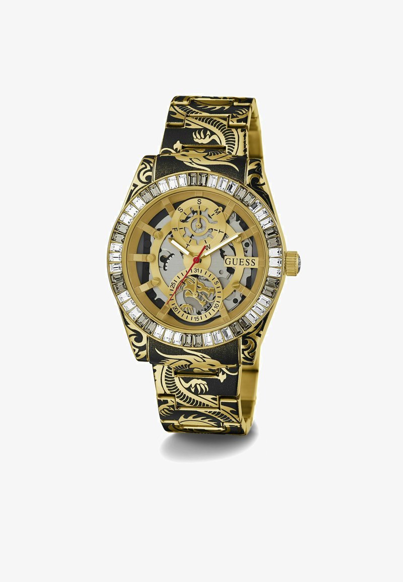 Gold-toned watch with a black band featuring dragon motifs, transparent casing, and a crystal-encrusted bezel. Red and black accents.