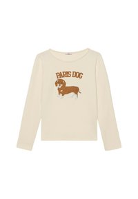 Camisa de manga larga color crema con un dachshund bordado en marrón y el texto "PERRO DE PARÍS" en marrón encima del diseño. Tejido de algodón suave.