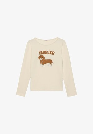 Chemise à manches longues crème avec un teckel brodé marron et le texte "PARIS DOG" en marron au-dessus du design. Tissu en coton doux.