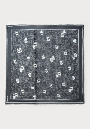 Black scarf featuring repeated white "Karl Lagerfeld" text and graphic designs of a character with glasses and white hair. Frayed edges.