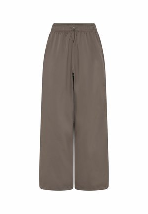 Lõdvalt istuvad pruunid püksid, millel on elastne vöökoht ja nöör, laiad sääred ning küljetaskud.