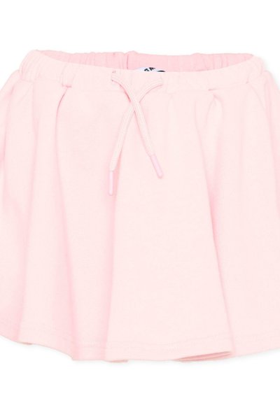 Jupe en tissu doux rose clair avec une taille élastique et un cordon noué à l'avant.