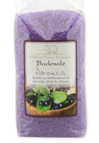 Purple bath salt in a clear bag, featuring a label with green leaves and dark berries, and a cartoon sheep logo. Suitable for relaxation.