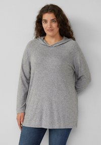 Grijze lange mouwen hoodie met een V-hals, gemaakt van zachte stof. Heeft raglanmouwen en een zijsplitzoom voor extra bewegingsvrijheid.
