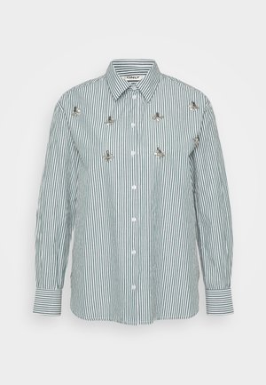 Striped long-sleeve shirt in green and white, featuring vertical stripes, a button front, and decorative metallic floral accents.