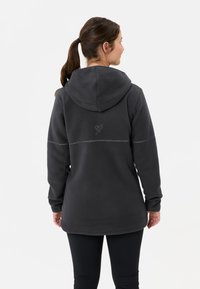 Felpa con cappuccio grigio scuro in pile, con tasca a marsupio, un dettaglio a cuore cucito sul retro e cappuccio regolabile con cordini. Texture morbida.