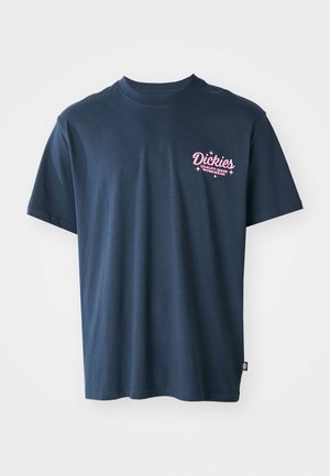 Navy blue cotton t-shirt featuring a pink printed logo on the chest with the text "Dickies Quality Made Workwear." Short sleeves, standard fit.