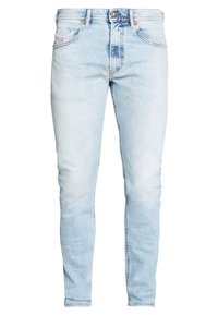 Bleknade ljusblå denimjeans med slim fit. Har fem fickor, dragkedja och subtila slitningar längs låren.