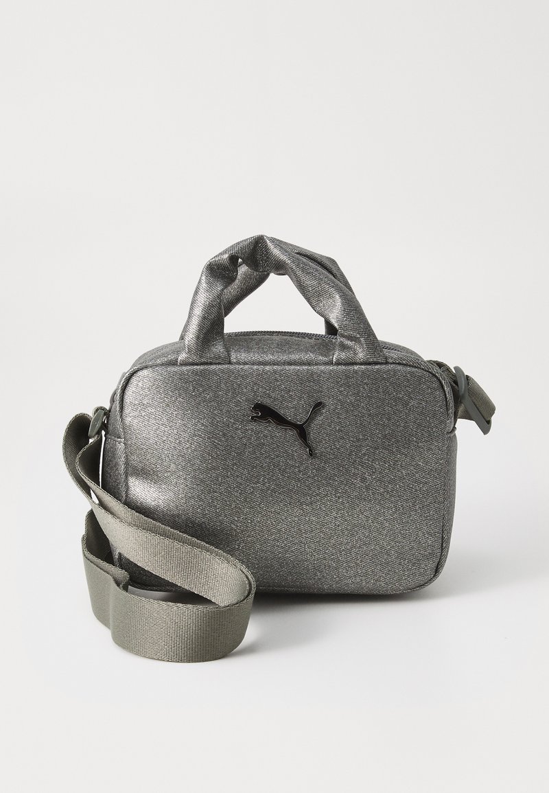 Gray glittery handbag with dual handles, adjustable strap, and black logo accent. Compact rectangular shape with textured material.