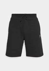 Schwarze Shorts aus Baumwollmischung mit elastischem Bund, Kordelzugverschluss und einem weißen Logo-Akzent auf der Vorderseite. Glatte Textur.