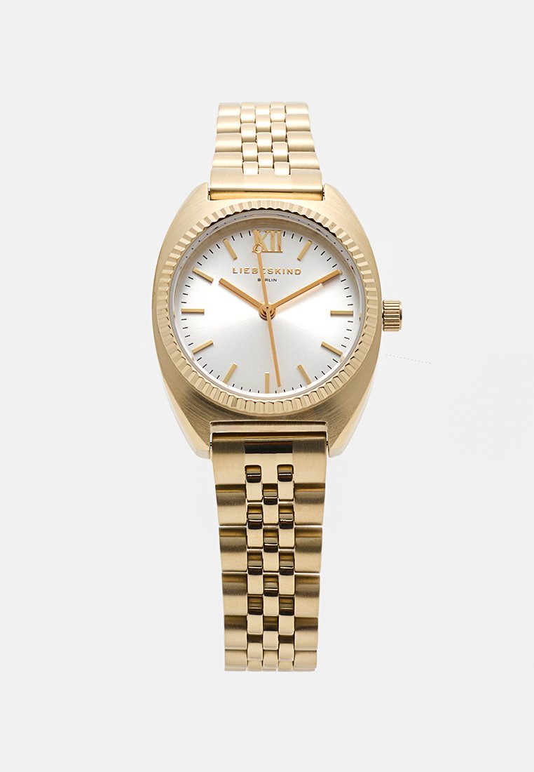 Gouden analoge horloge met een ronde kast, zilveren wijzerplaat, gestructureerde bezel en een schakelband. Bevat uurmarkers en een kroon aan de zijkant.