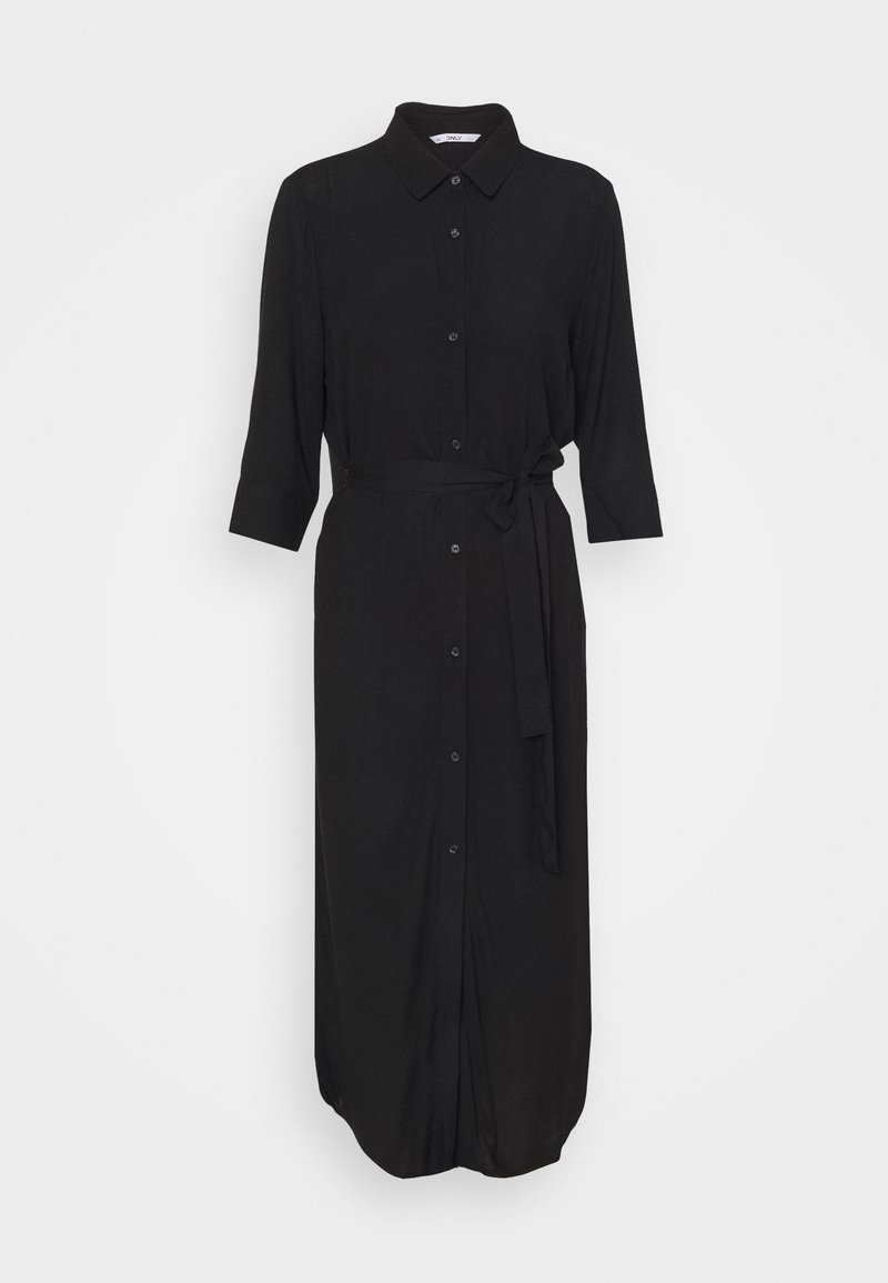 Robe chemise midi noire à manches longues, col, boutonnage devant et ceinture nouée à la taille sur fond clair uni.