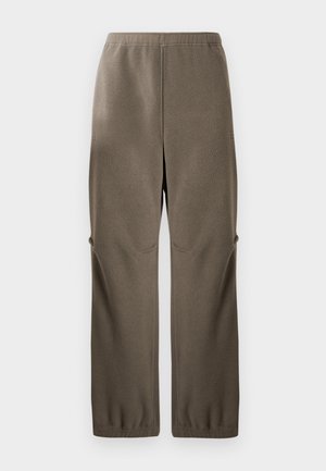 Fleece pants in olive green, featuring a relaxed fit, elastic waistband, side pockets, and textured surface for warmth.