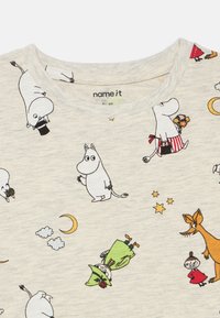 Short-sleeved, light gray cotton T-shirt featuring Moomin character prints in black and colorful accents, including moons and clouds.